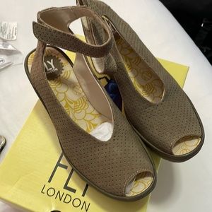 Brand new never worn Fly London wedge pumps. Size 40. Paid $119.95